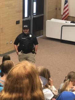 Officer Wolfgramm helps students understand what it is like to be a police officer